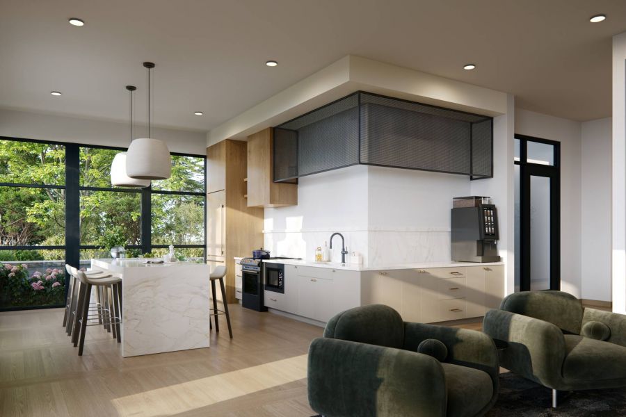 Royce Townhomes Modern kitchen with white island, marble countertops, green chairs, large windows, and natural light streaming in.