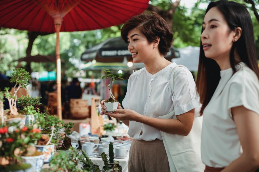 Young Women Shopping at Outdoor Farmer's Market